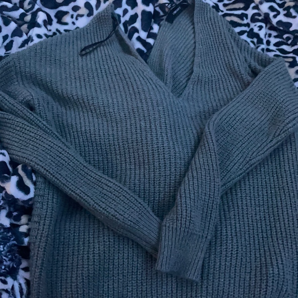 Gray sweater tied back